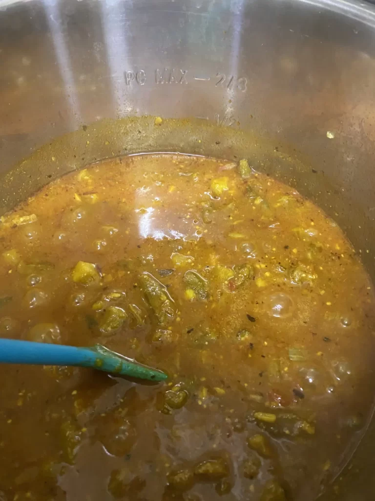 Stirring the Okra Stew in the Instant Pot