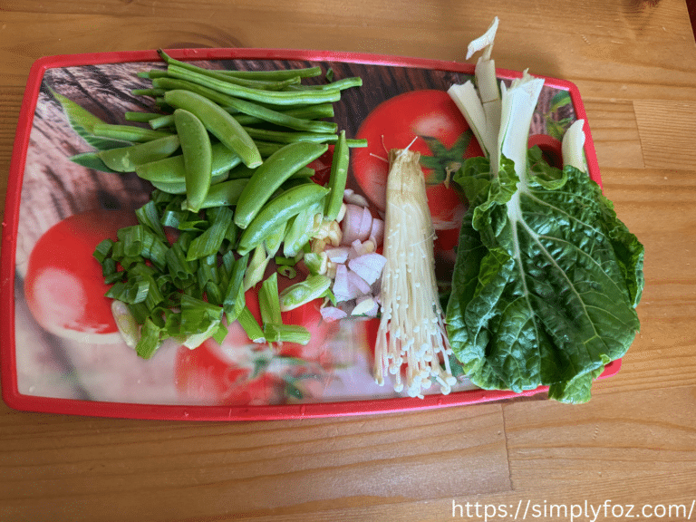 Fresh ingredients including bok choy, green beans, and enoki mushrooms for instant healthy noodles